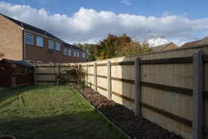 1.8m high closeboard on concrete posts with capping