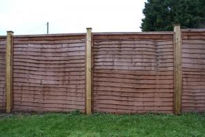 1.8m high Windcheater panels with 4x4" wooden posts