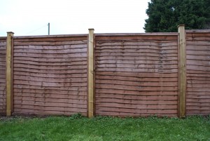 1.8m high Windcheater panels with 4x4" wooden posts